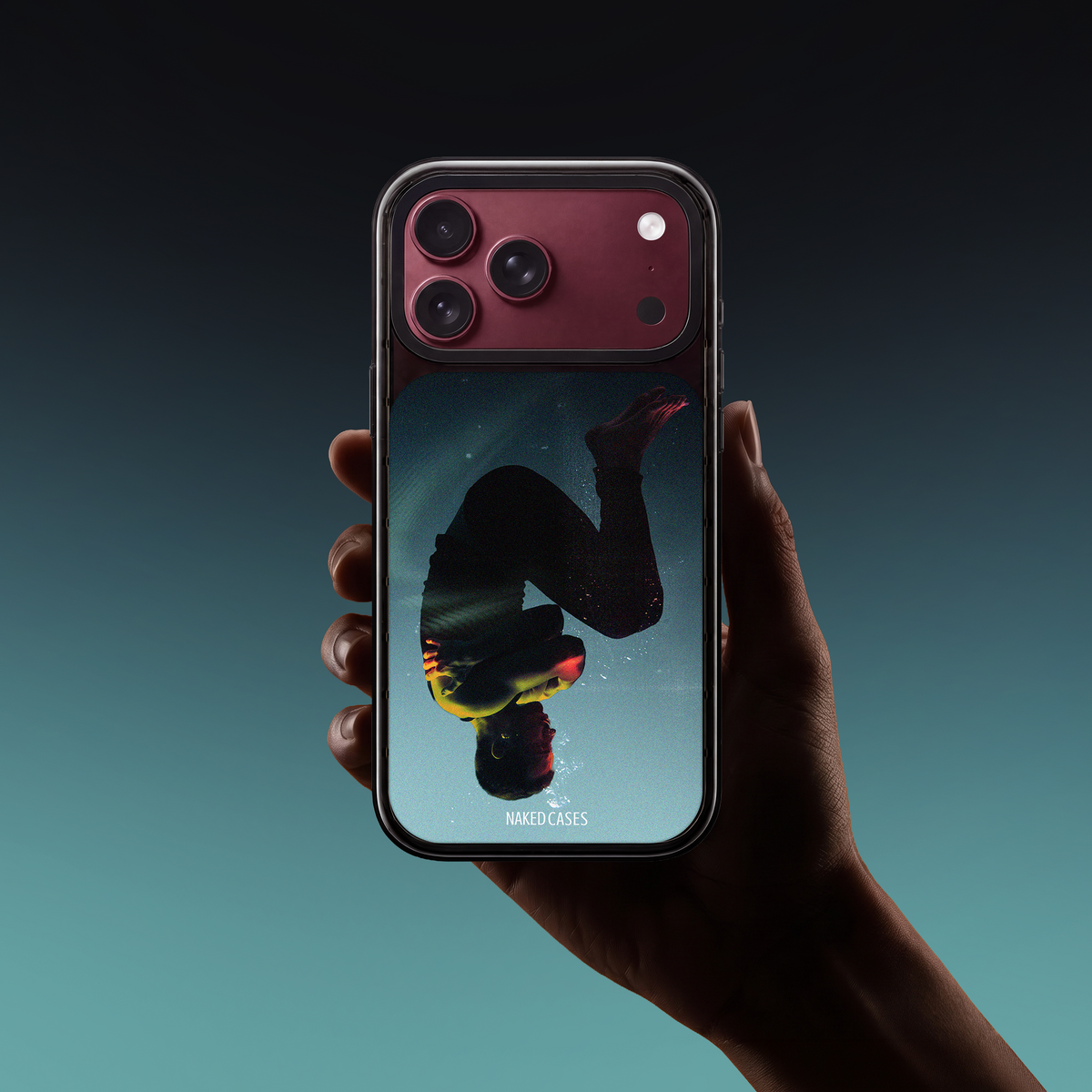 UNLOVED — Collection 01 Naked iPhone case, held in hand.